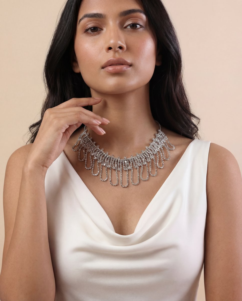 AI-generated jewelry on model — crystal statement necklace on white satin cowl-neck top